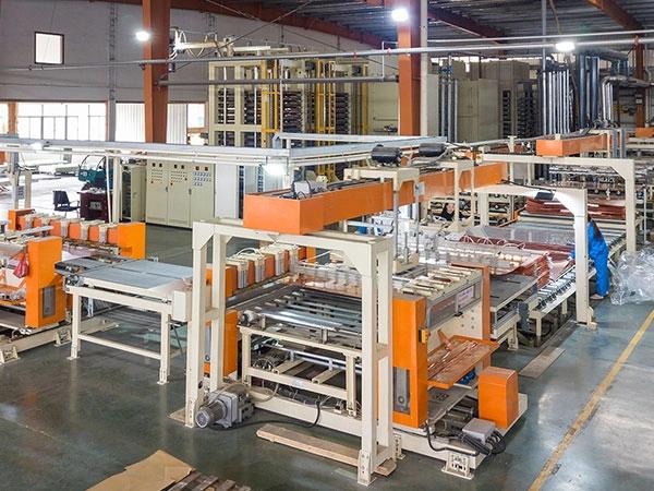Automated composite sheet manufacturing facility